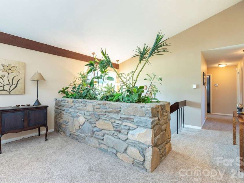 127 College Circle, Swannanoa, NC 28778.  MLS# CAR4427251, YatesRealty ID 52594. Living room entry - stone planter feature