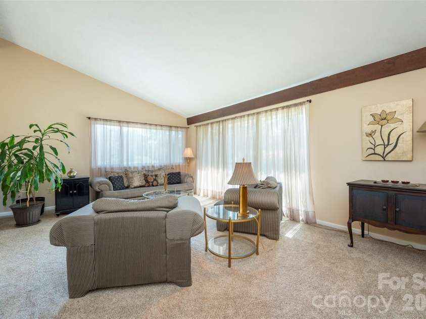 127 College Circle, Swannanoa, NC 28778.  MLS# CAR4427251, YatesRealty ID 52594. Living room - vaulted ceilings - mountain view windows