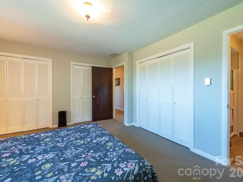 127 College Circle, Swannanoa, NC 28778.  MLS# CAR4427251, YatesRealty ID 52594. Primary bedroom with double closets