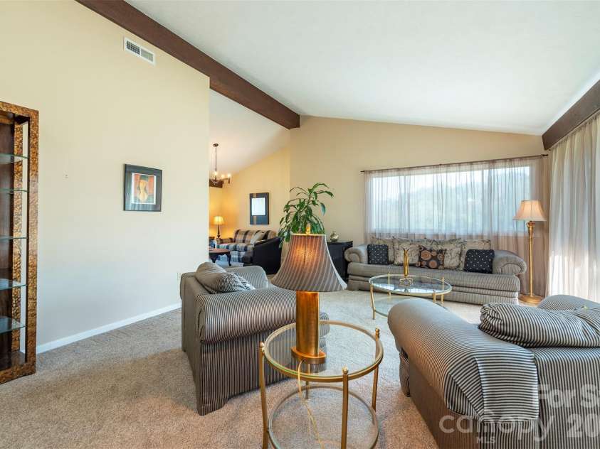 127 College Circle, Swannanoa, NC 28778.  MLS# CAR4427251, YatesRealty ID 52594. Spacious living room - neutral carpet - natural light