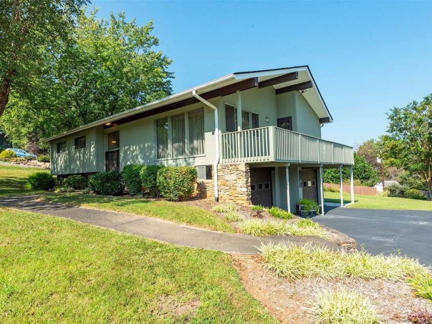 127 College Circle, Swannanoa, NC 28778.  MLS# CAR4427251, YatesRealty ID 52594. Split-level home - wrap-around deck - mountain backdrop