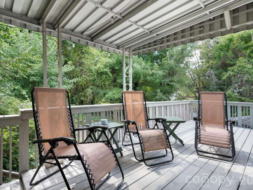 109 Wilshire Drive, Asheville, NC 28806.  MLS# CAR4421806, YatesRealty ID 52602. Relax outside on the covered deck