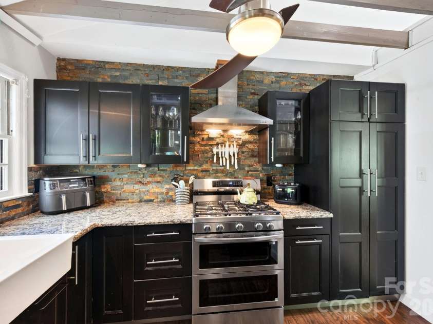 109 Wilshire Drive, Asheville, NC 28806.  MLS# CAR4421806, YatesRealty ID 52602. Updated cooks kitchen with a gas range with double oven