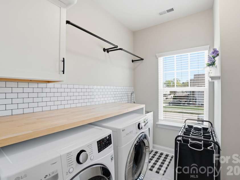 3046 Woodlands Creek Drive, Monroe, NC 28110.  MLS# CAR4366834, YatesRealty ID 52603. Laundry Rm Upstairs