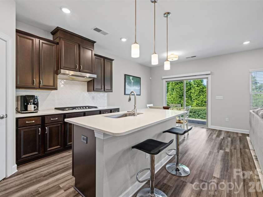 14830 Batteliere Drive, Charlotte, NC 28278.  MLS# CAR4424423, YatesRealty ID 52604. Imagine the fun conversations at this island.