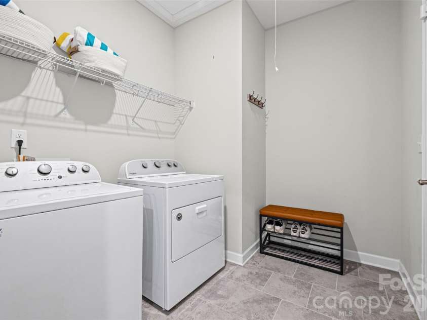 14830 Batteliere Drive, Charlotte, NC 28278.  MLS# CAR4424423, YatesRealty ID 52604. Large laundry room with jut-out for storage.
