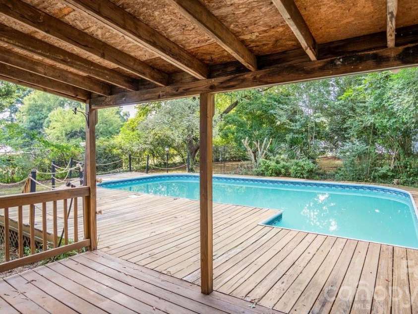 78 Stonecrest Circle, Concord, NC 28027.  MLS# CAR4426598, YatesRealty ID 52640. Covered Rear Deck & In-ground Pool