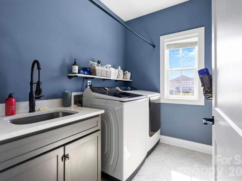 2665 Umberger Road, Cleveland, NC 27013.  MLS# CAR4425571, YatesRealty ID 52643. Laundry room with sink right off garage on main level