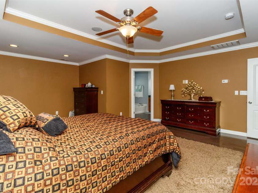 706 Springwood Drive, Waxhaw, NC 28173.  MLS# CAR4240663, YatesRealty ID 5265. Double doors lead to this primary bedroom
