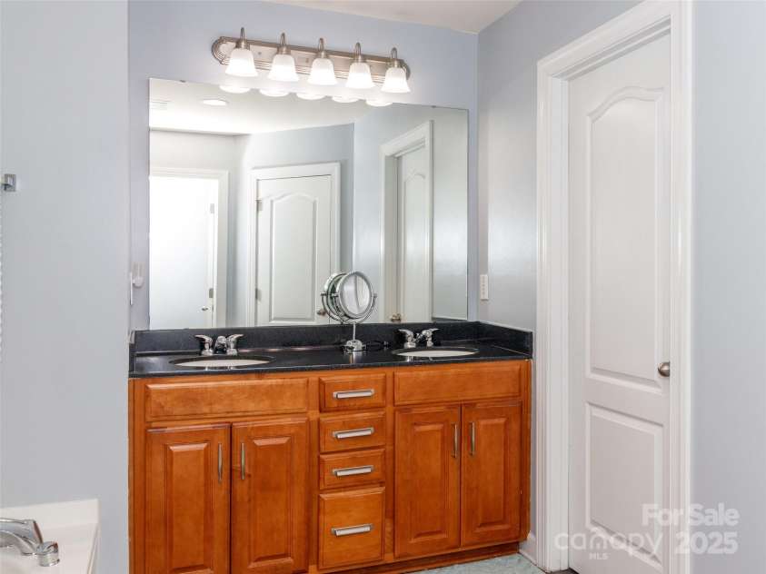 706 Springwood Drive, Waxhaw, NC 28173.  MLS# CAR4240663, YatesRealty ID 5265. Double sinks in primary bath