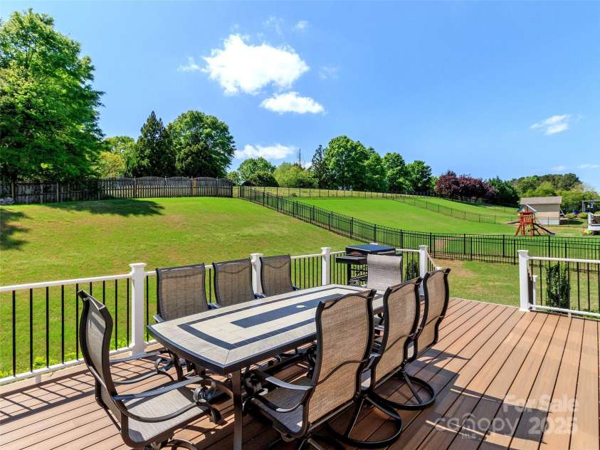 706 Springwood Drive, Waxhaw, NC 28173.  MLS# CAR4240663, YatesRealty ID 5265. Great area for entertaining with privacy trees in backyard