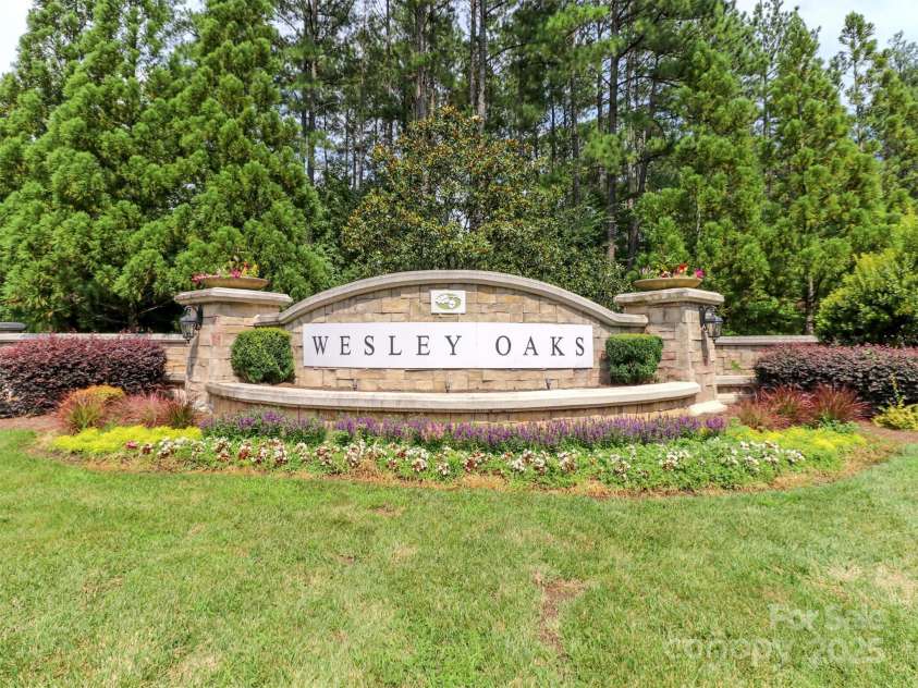 706 Springwood Drive, Waxhaw, NC 28173.  MLS# CAR4240663, YatesRealty ID 5265. Magnificent entrance monument