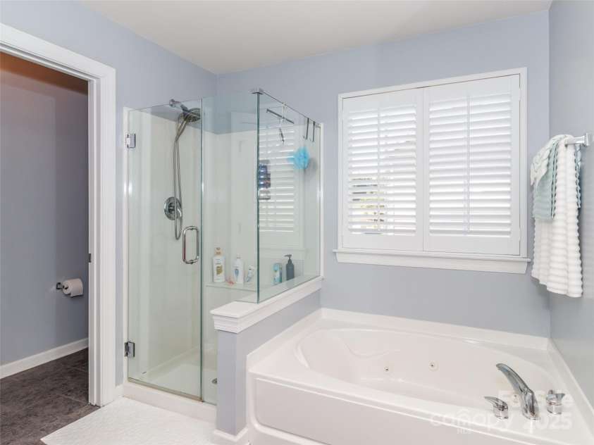 706 Springwood Drive, Waxhaw, NC 28173.  MLS# CAR4240663, YatesRealty ID 5265. Primary bath with newer seamless shower