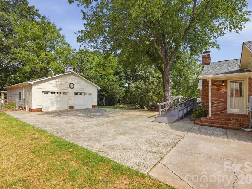 3007 Plentywood Drive, Matthews, NC 28105.  MLS# CAR4425834, YatesRealty ID 52650. Two-car Garage with Workshop