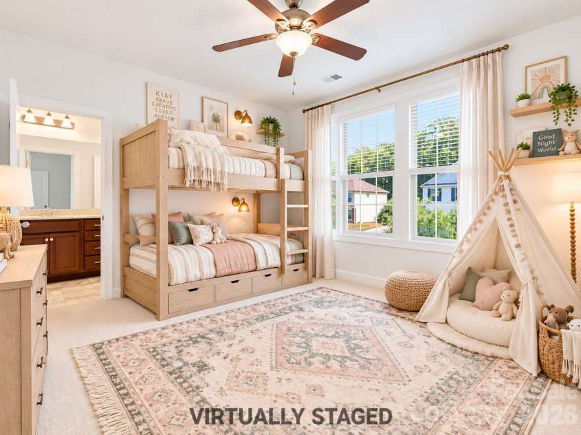 8315 Breton Way, Harrisburg, NC 28075.  MLS# CAR4426522, YatesRealty ID 52653. Virtually staged, this bright second-level bedroom shows how easily the space can accommodate sleeping, relaxing, and imaginative uses, with three sunny windows and its own dedicated full en suite bathroom.