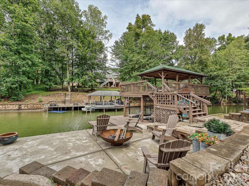 3017 Vernell Lane, Shelby, NC 28150.  MLS# CAR4425376, YatesRealty ID 52670. Multi-level covered boat dock/slip with covered entertaining space offers direct water access and plenty of room to relax, gather, and enjoy lakeside living.