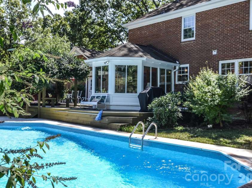 500 Laurel Fork Drive, Matthews, NC 28105.  MLS# CAR4424461, YatesRealty ID 52672. Pool and Sunroom
