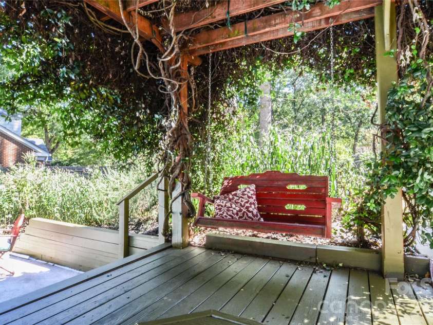 500 Laurel Fork Drive, Matthews, NC 28105.  MLS# CAR4424461, YatesRealty ID 52672. Swing under Jasmine-Covered Pergola