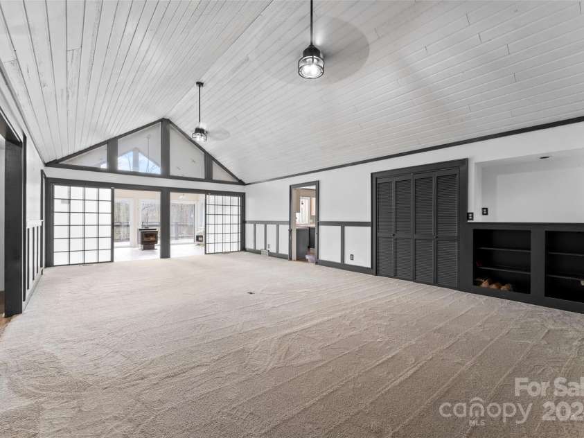 158 Glen Echo Lane, Hendersonville, NC 28739.  MLS# CAR4197828, YatesRealty ID 5268. Main Level Living Room and Dining Area and Sunroom