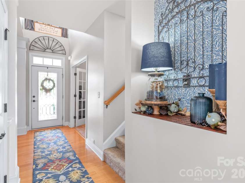 3327 Brackhill Street, Davidson, NC 28036.  MLS# CAR4418504, YatesRealty ID 52682. A two story front entry filled with light greets you as you step in.