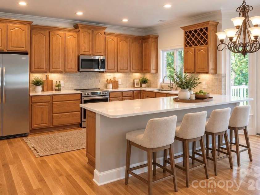 140 Holt Lane, Mooresville, NC 28117.  MLS# CAR4424635, YatesRealty ID 52690. Virtually staged kitchen with breakfast bar.