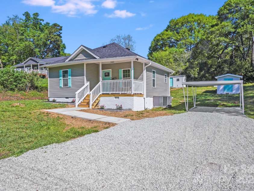 221 River Loop Road, Belmont, NC 28012.  MLS# CAR4245152, YatesRealty ID 5271. Brand new gravel driveway. Carport and two storage sheds on property.