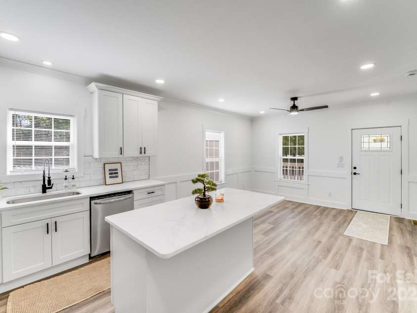 221 River Loop Road, Belmont, NC 28012.  MLS# CAR4245152, YatesRealty ID 5271. Kitchen island with view of living room.