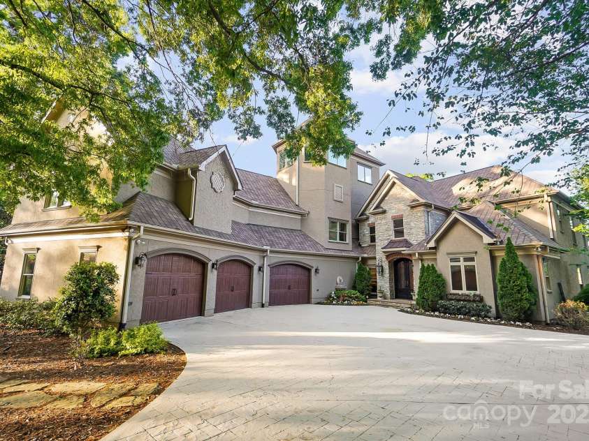 20428 Island Forest Drive, Cornelius, NC 28031.  MLS# CAR4243921, YatesRealty ID 5277. 3 car garge & stunning presence.
