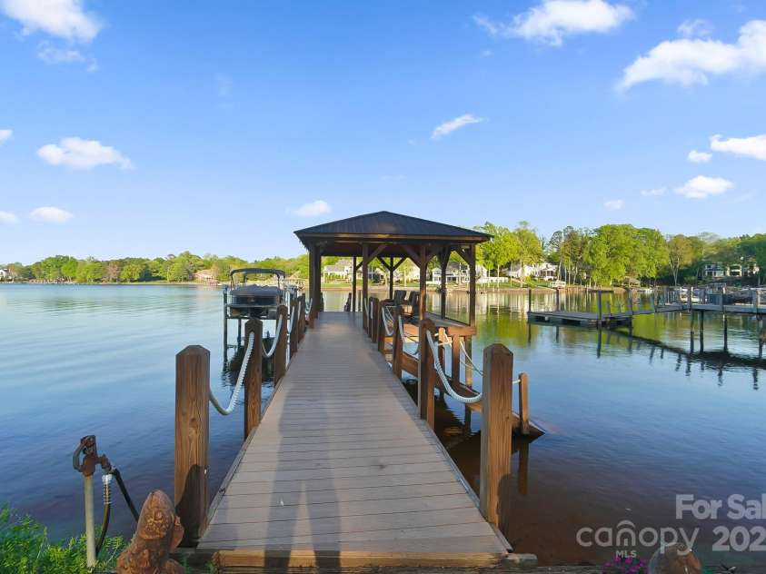 20428 Island Forest Drive, Cornelius, NC 28031.  MLS# CAR4243921, YatesRealty ID 5277. Covered dock offers yet another place to enjoy the amazing lake views!