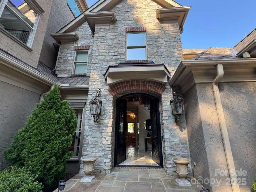 20428 Island Forest Drive, Cornelius, NC 28031.  MLS# CAR4243921, YatesRealty ID 5277. Elevated entrance, with 2 story stacked stone.