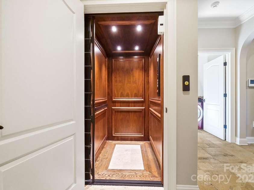 20428 Island Forest Drive, Cornelius, NC 28031.  MLS# CAR4243921, YatesRealty ID 5277. Elevator makes getting to the 2nd floor a breeze!