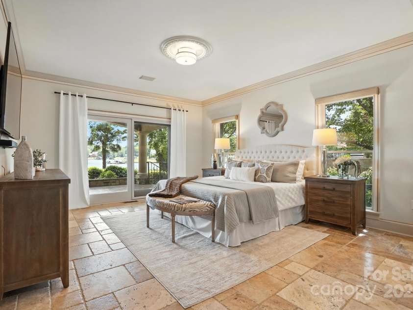 20428 Island Forest Drive, Cornelius, NC 28031.  MLS# CAR4243921, YatesRealty ID 5277. Enjoy serene lake views from the main level Master Bedroom