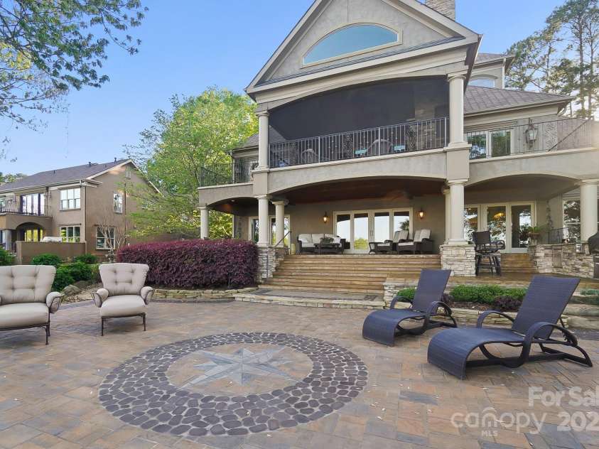 20428 Island Forest Drive, Cornelius, NC 28031.  MLS# CAR4243921, YatesRealty ID 5277. Enjoy the lower patio, covered patio or upper 3 balconies.  Options are endless!