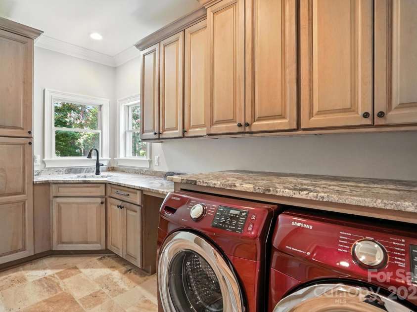 20428 Island Forest Drive, Cornelius, NC 28031.  MLS# CAR4243921, YatesRealty ID 5277. Even the laundry room left no detail undone.  Sink, abundant counters & cabinets!