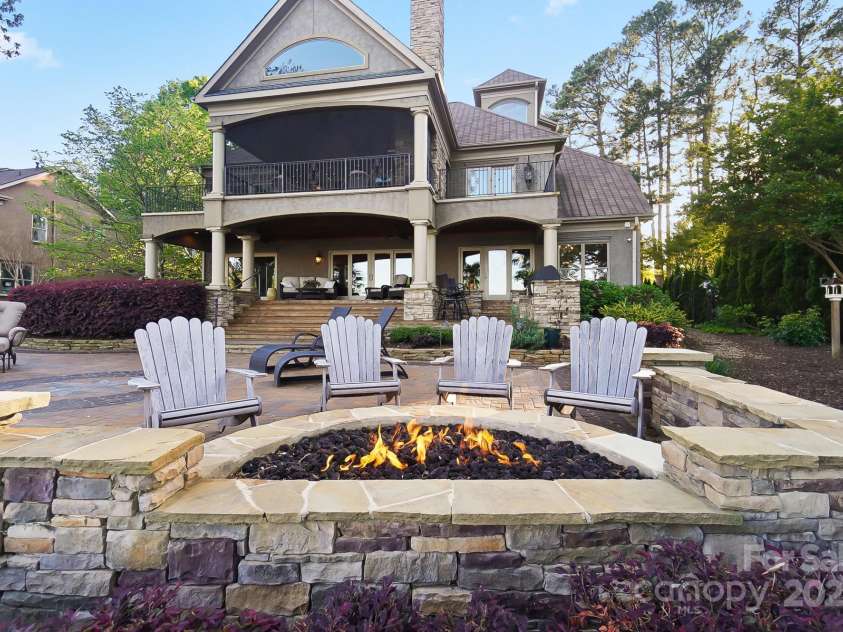 20428 Island Forest Drive, Cornelius, NC 28031.  MLS# CAR4243921, YatesRealty ID 5277. Fire pit and grand patio perfect for entertaining!