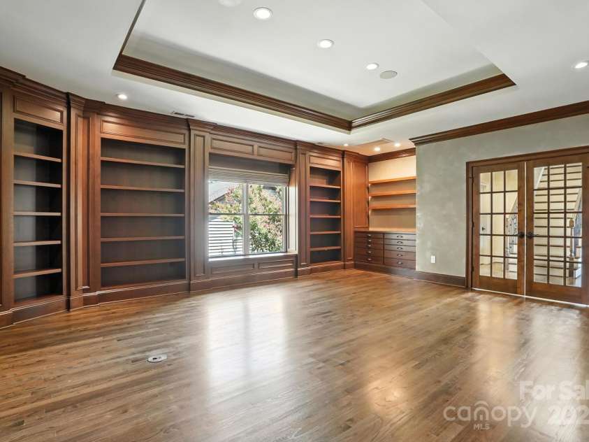 20428 Island Forest Drive, Cornelius, NC 28031.  MLS# CAR4243921, YatesRealty ID 5277. Grand library with distinct & beautiful moldings and fireplace