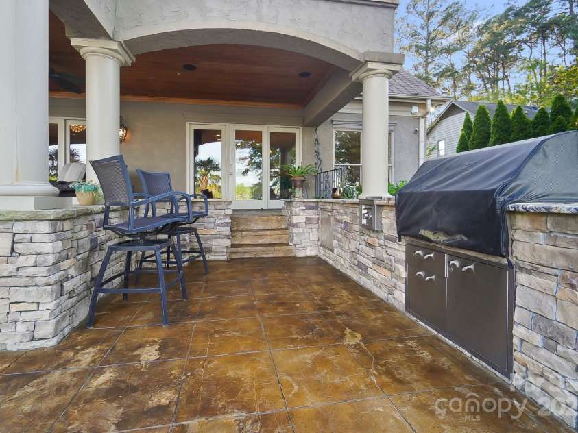 20428 Island Forest Drive, Cornelius, NC 28031.  MLS# CAR4243921, YatesRealty ID 5277. Outdoor Kitchen overlooking open water views.