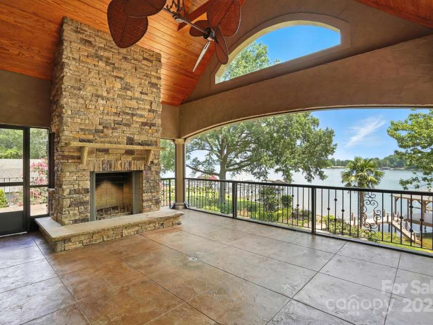 20428 Island Forest Drive, Cornelius, NC 28031.  MLS# CAR4243921, YatesRealty ID 5277. Screened center balcony offers amazing views and cozy fireplace!