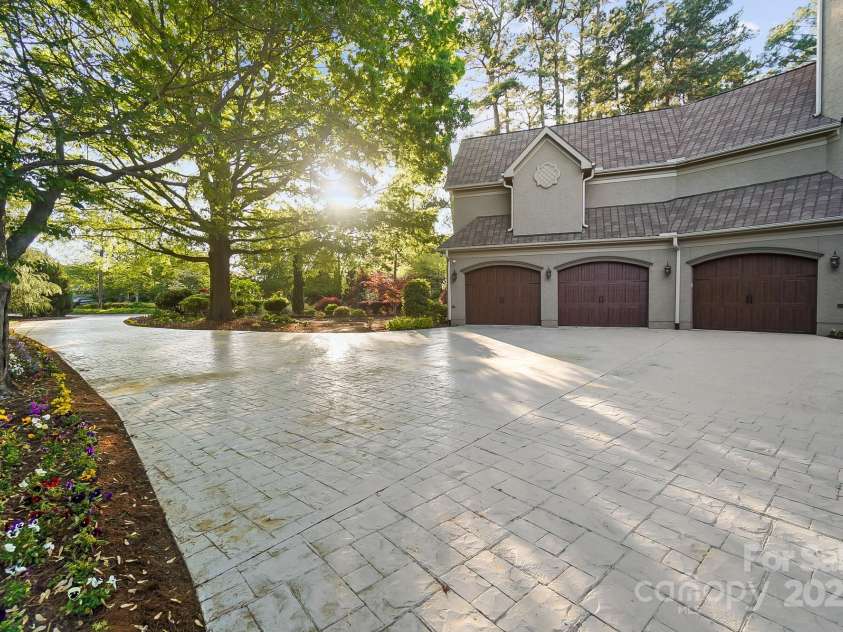 20428 Island Forest Drive, Cornelius, NC 28031.  MLS# CAR4243921, YatesRealty ID 5277. The stamped driveway welcomes guests into luxury as soon as they enter.
