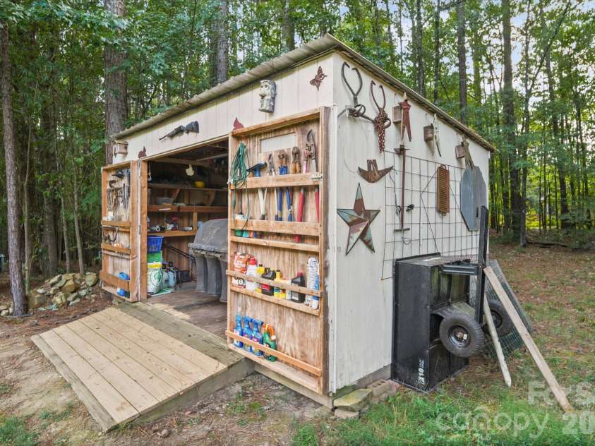 420 Panther Point Trail, Richfield, NC 28137.  MLS# CAR4423340, YatesRealty ID 52788. Lawnmower Shed