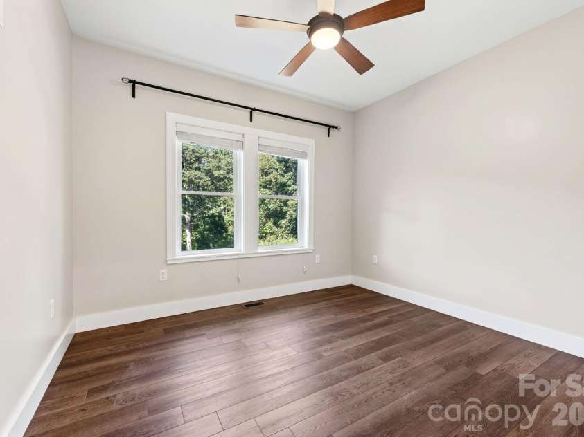 139 Ridge Road, Candler, NC 28715.  MLS# CAR4426704, YatesRealty ID 52790. Back Bedroom
