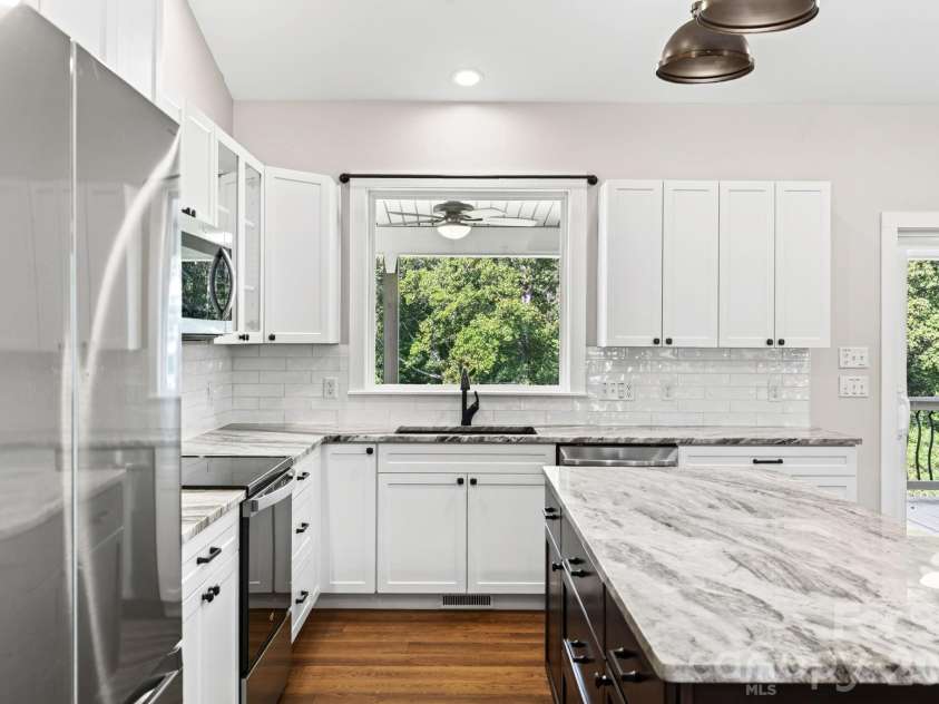 139 Ridge Road, Candler, NC 28715.  MLS# CAR4426704, YatesRealty ID 52790. Kitchen upgraded with additional upper cabinetry and backsplash