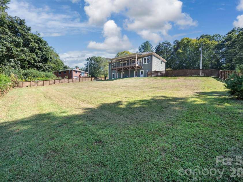 139 Ridge Road, Candler, NC 28715.  MLS# CAR4426704, YatesRealty ID 52790. Large fully fenced gently sloping backyard