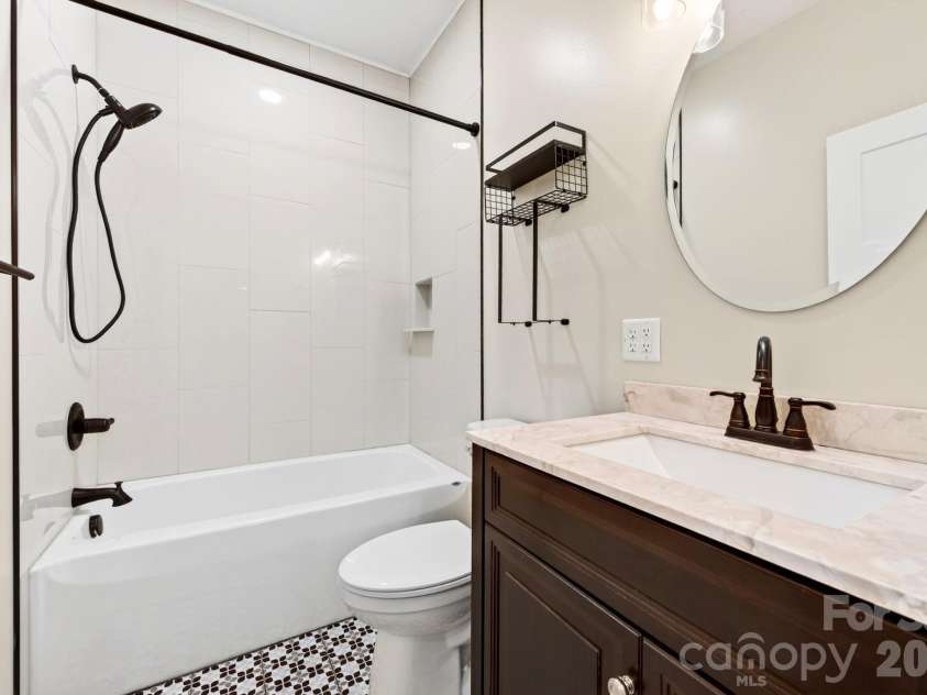 139 Ridge Road, Candler, NC 28715.  MLS# CAR4426704, YatesRealty ID 52790. To another full bathroom