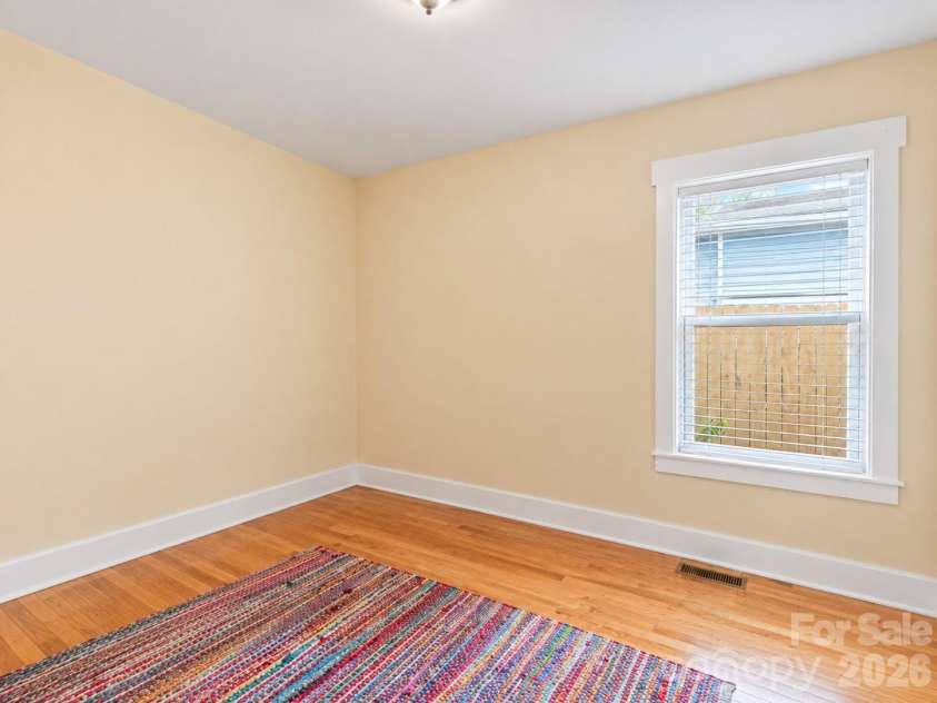 3 Byrdcliffe Lane, Asheville, NC 28805.  MLS# CAR4426745, YatesRealty ID 52814. Guest bedroom - digitally decluttered
