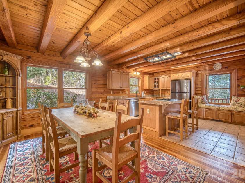 459 West Club Boulevard, Lake Toxaway, NC 28747.  MLS# CAR4220755, YatesRealty ID 5283. Kitchen and dining space designed for easy entertaining