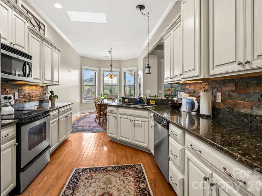 27 Dreambird Drive, Leicester, NC 28748.  MLS# CAR4424552, YatesRealty ID 52857. Light and bright kitchen and dining