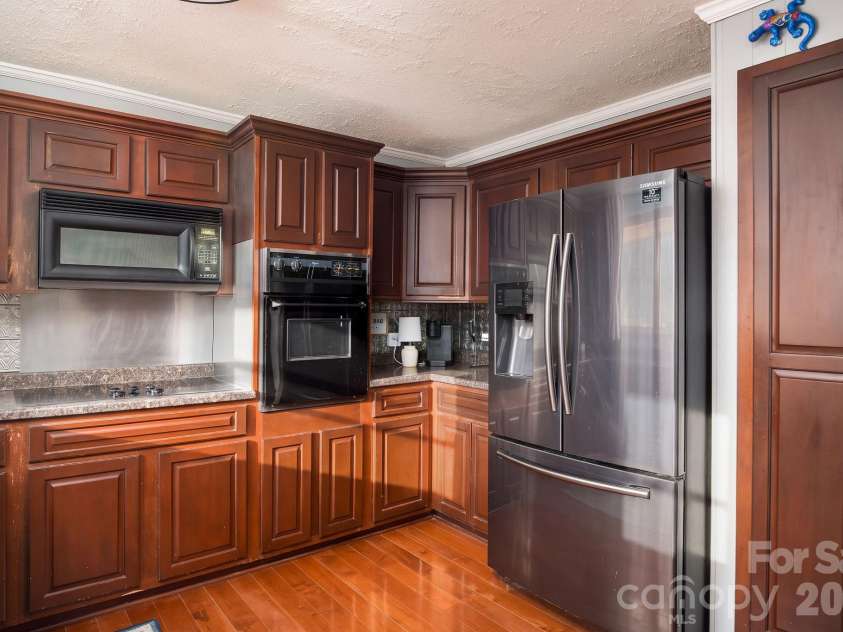 3910 Fallston Road, Shelby, NC 28150.  MLS# CAR4427337, YatesRealty ID 52858. Beautiful kitchen with built in microwave and oven!