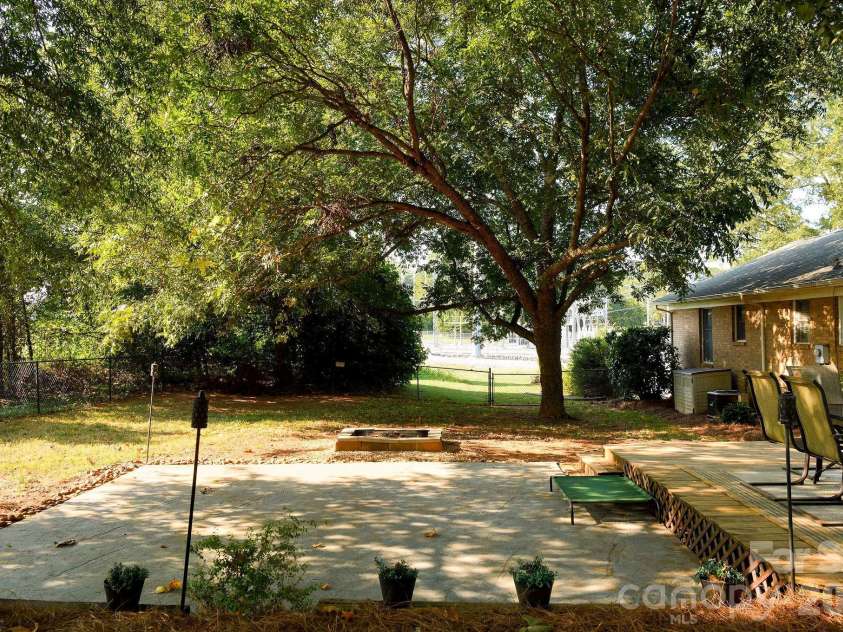 3910 Fallston Road, Shelby, NC 28150.  MLS# CAR4427337, YatesRealty ID 52858. Concrete pad and a fire pit complete this great back yard!
