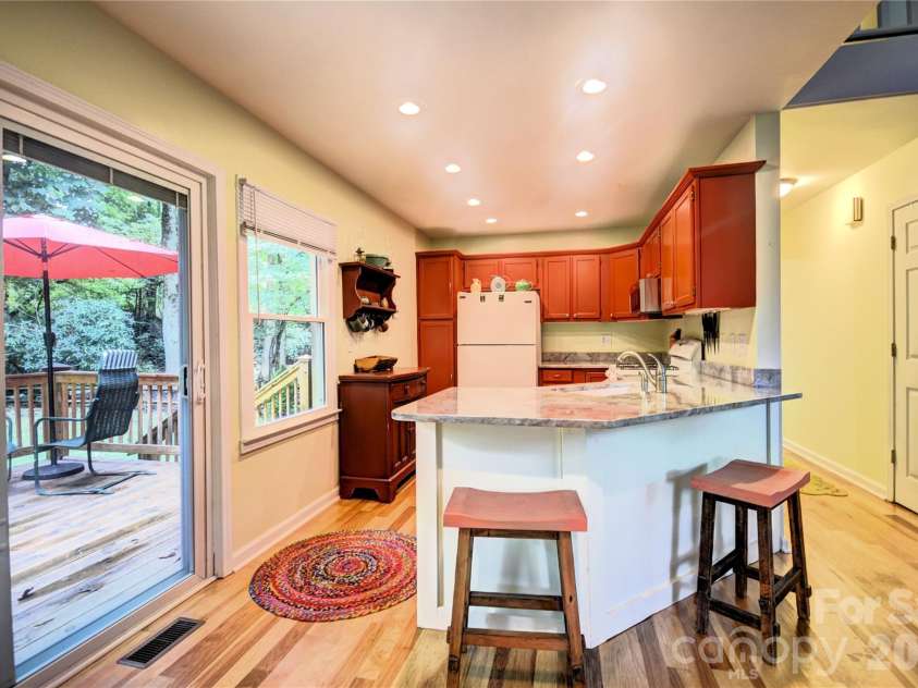 98 Indian Trace Road, Maggie Valley, NC 28751.  MLS# CAR4427039, YatesRealty ID 52864. Breakfast Bar and Kitchen from the dining area